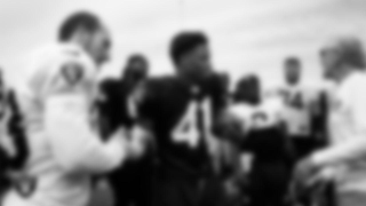 Las Vegas Raiders running back Dylan Laube (23) and cornerback Greedy Vance (41) during practice at Intermountain Health Performance Center.