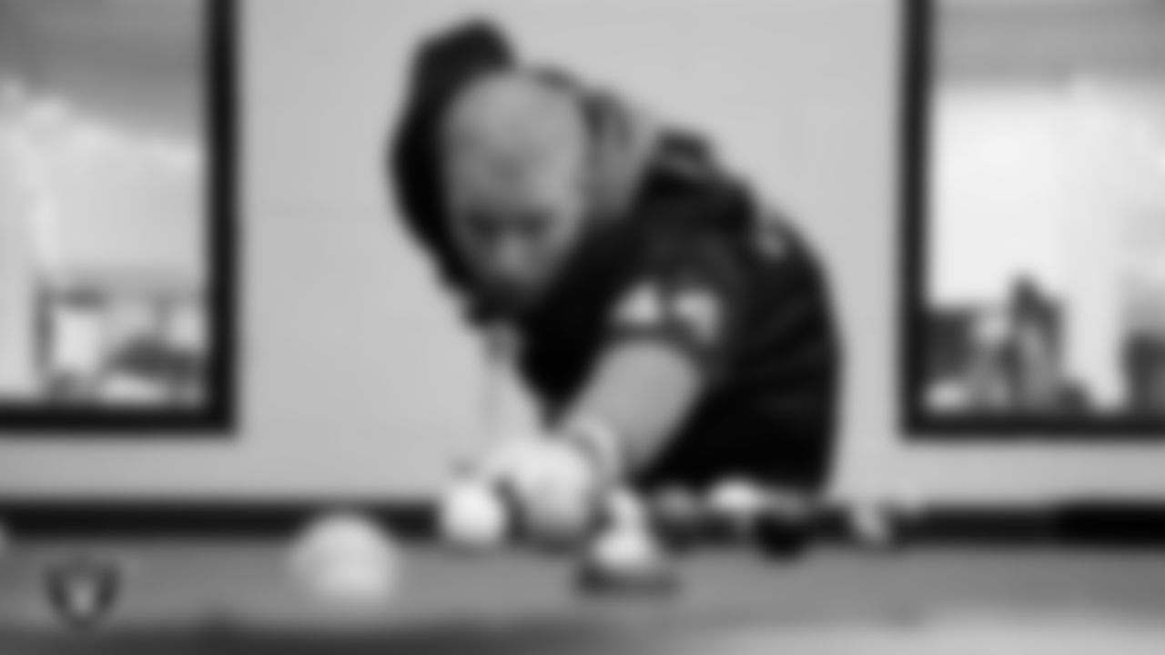 Las Vegas Raiders linebacker Tommy Eichenberg (44) shoots pool with members of the Boys and Girls Club at the Lied Memorial Boys & Girls Clubs of Southern Nevada.