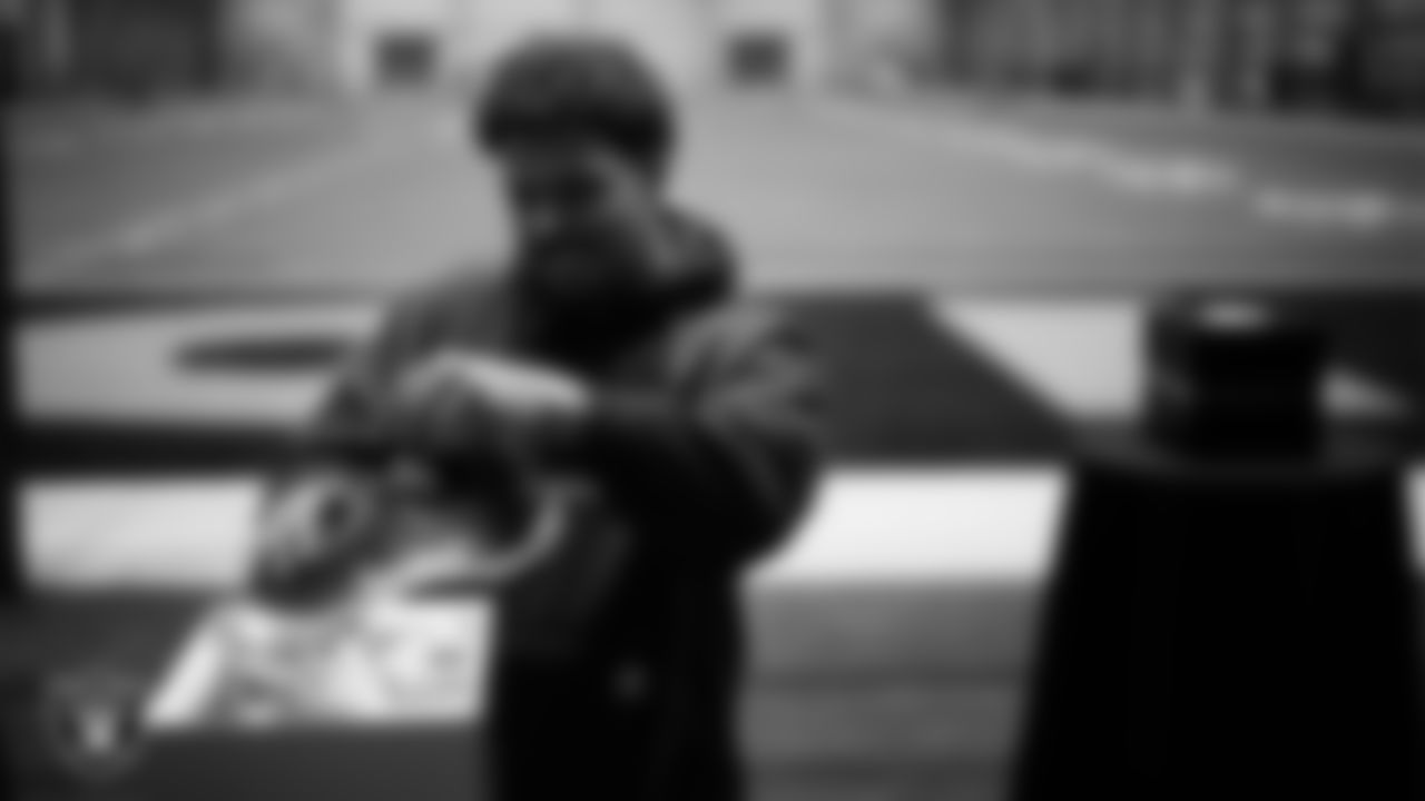 Las Vegas Raiders guard Caleb Rogers (76) unboxes his custom cleats for the NFL's My Cause My Cleats initiative at Intermountain Health Performance Center.