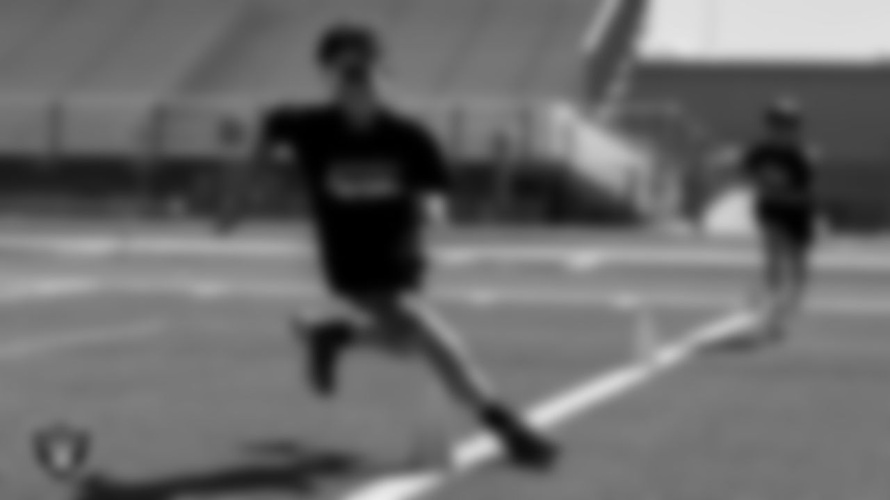 An athlete participates in a drill during the Play Football Youth Combine at Silverado High School.