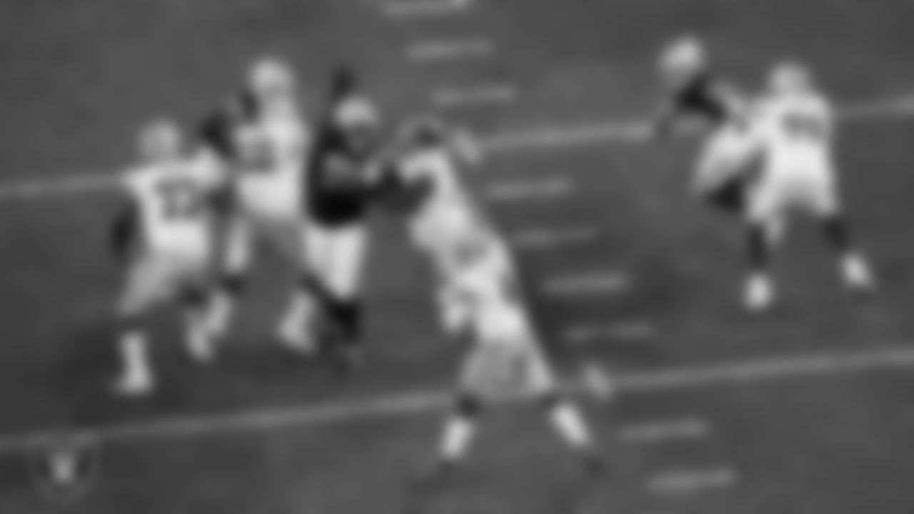 Las Vegas Raiders defensive tackle Thomas Booker IV (99) pressures the quarterback during the regular season home game against the Dallas Cowboys at Allegiant Stadium.