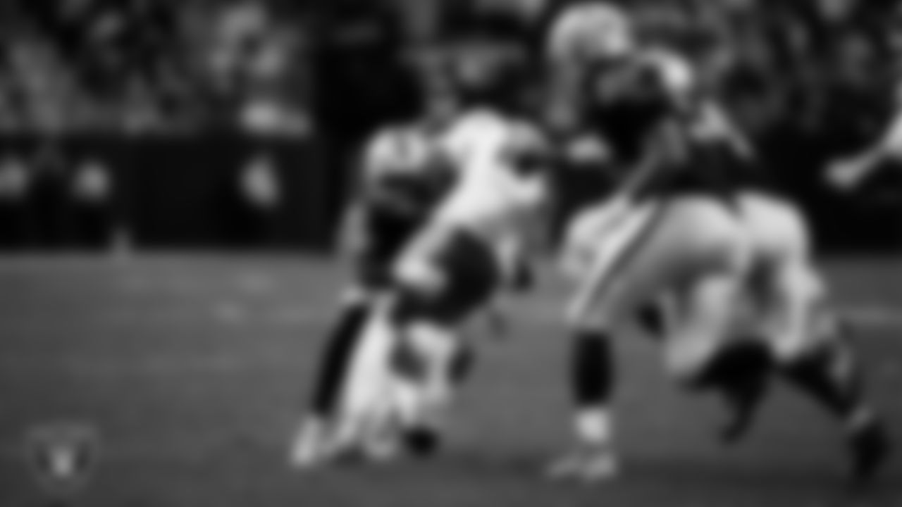 Las Vegas Raiders cornerback Darien Porter (26) makes a tackle during the regular season home game against the Kansas City Chiefs at Allegiant Stadium.