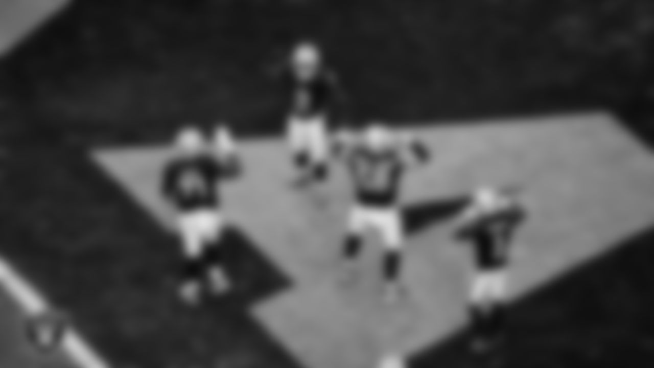 Las Vegas Raiders running back Ashton Jeanty (2) celebrates with center Jackson Powers-Johnson (58) after making an 8-yard touchdown catch during the regular season home game against the Chicago Bears at Allegiant Stadium.