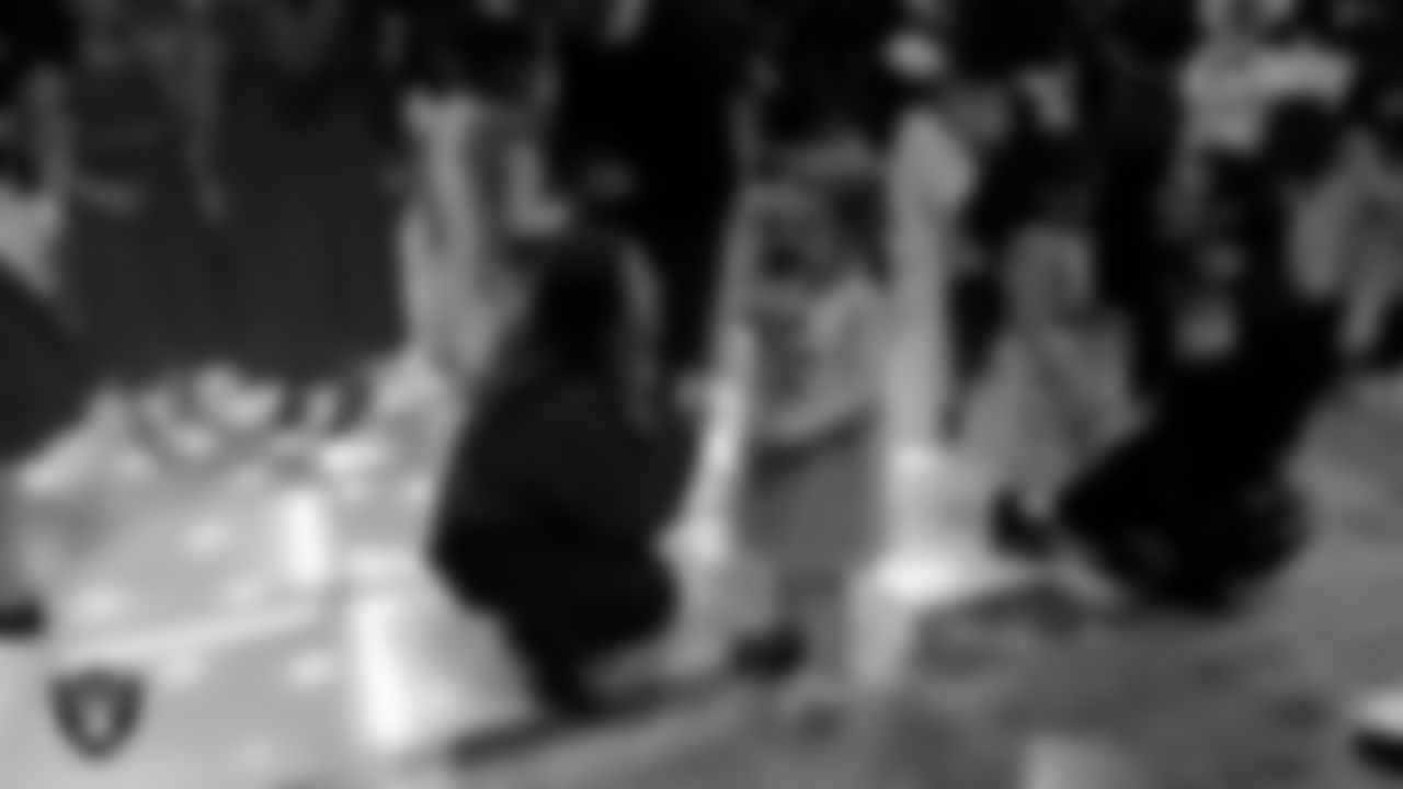 Attendees exchange roses during the Valentine's Day Dance at The Studio.