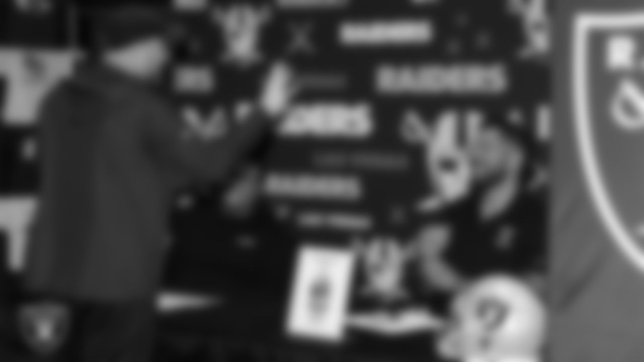 Las Vegas Raiders alumnus Robert Gallery speaks with a high school football coach during a Glazier Clinic at Grand Sierra Resort.