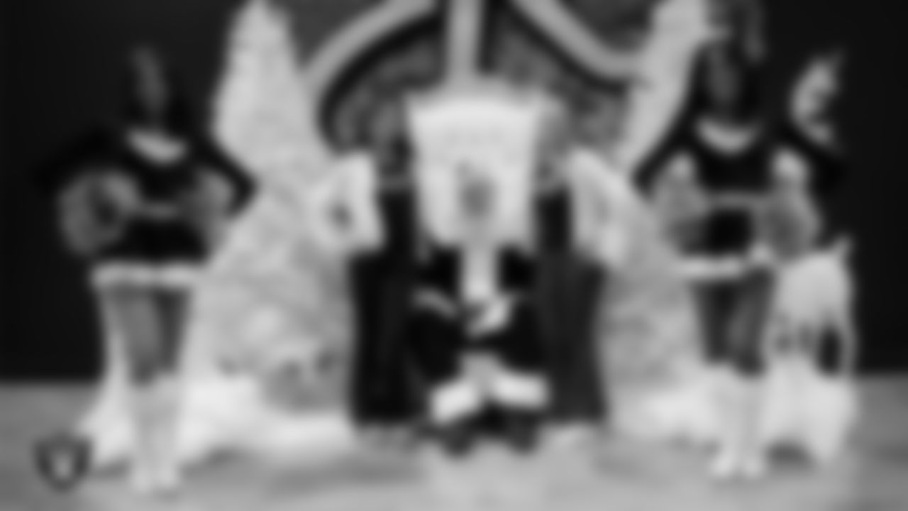 Junior Raiderettes pose for a photo with Santa during the Junior Raiderettes Banquet at The Studio.