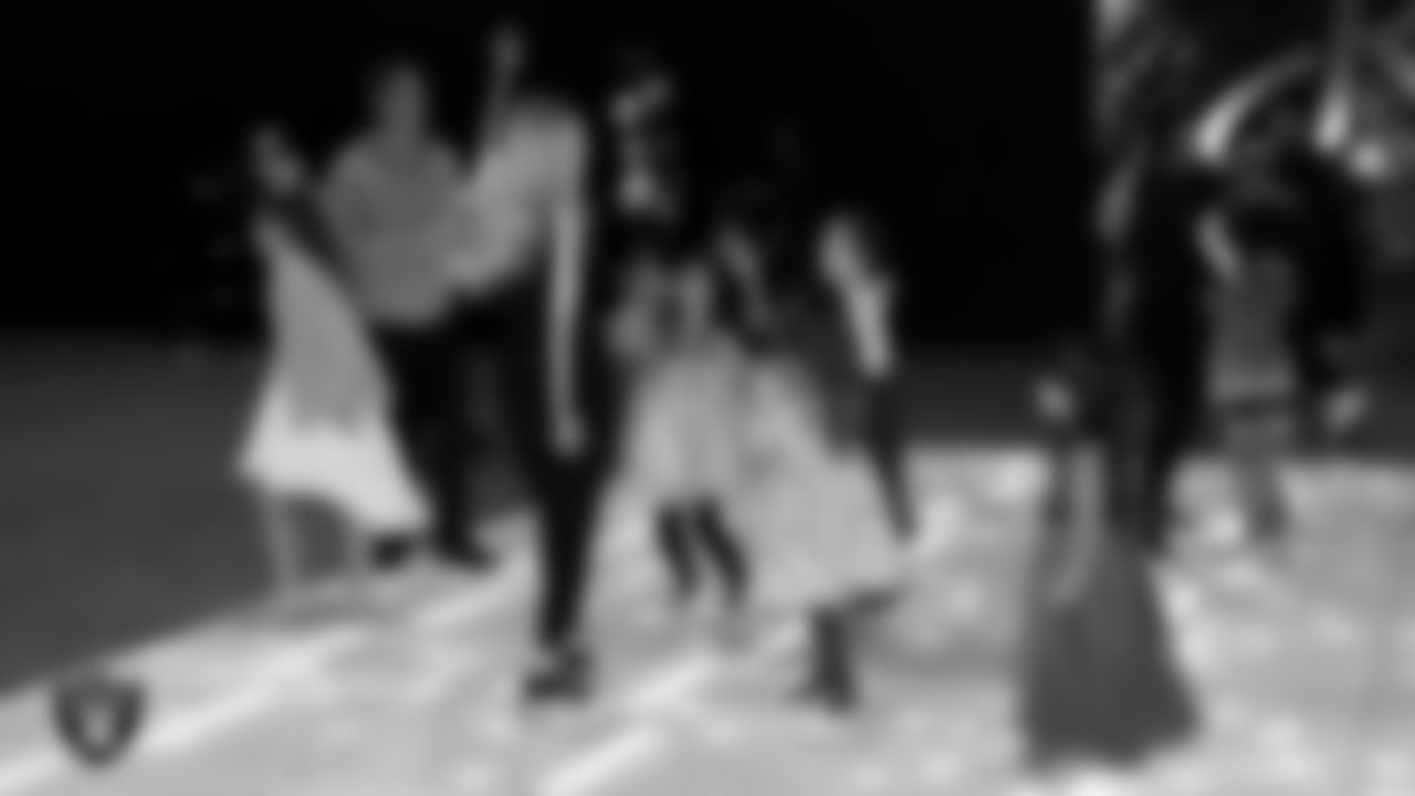 Raiderette Delaney dances with attendees during the Valentine's Day Dance at The Studio.