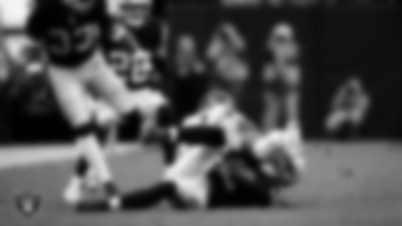 Las Vegas Raiders safety Lonnie Johnson Jr. (32) makes a tackle during the regular season home game against the Kansas City Chiefs at Allegiant Stadium.