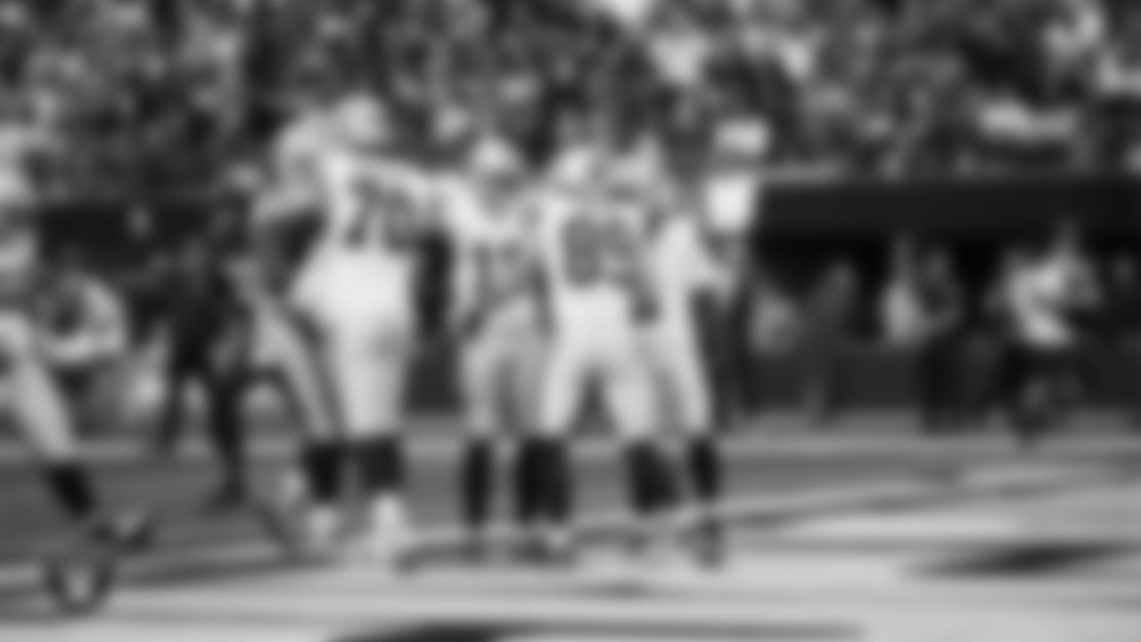 Las Vegas Raiders tight end Brock Bowers (89) celebrates with teammates after making a 6-yard touchdown catch during the regular season away game against the Los Angeles Chargers at SoFi Stadium.