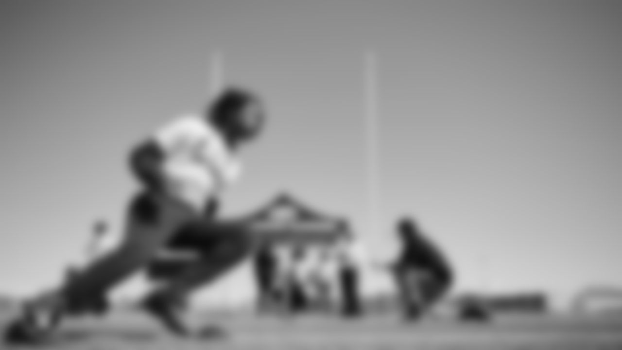 An athlete goes through a drill during a youth football combine at Durango High School.