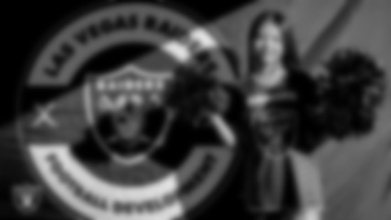 An athlete poses for a photo during Silver and Black Saturday at Liberty High School.