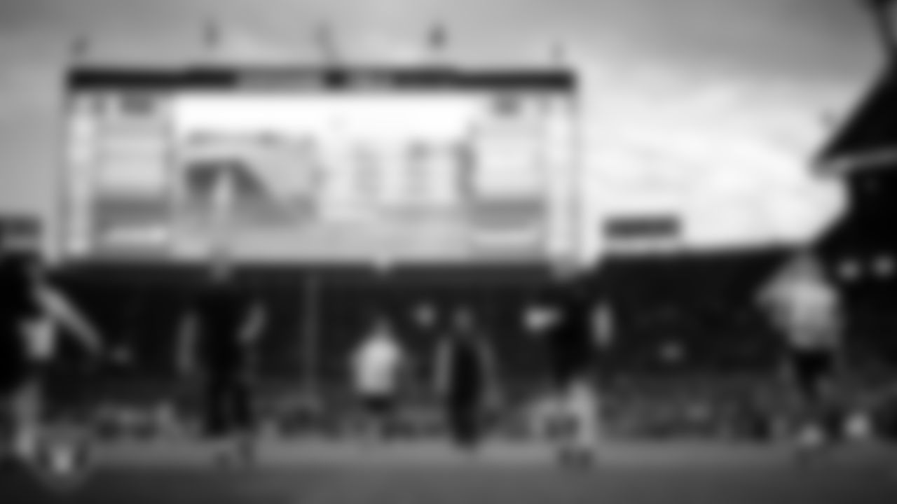 The Las Vegas Raiders warming up before the regular season away game against the Denver Broncos at Empower Field at Mile High.