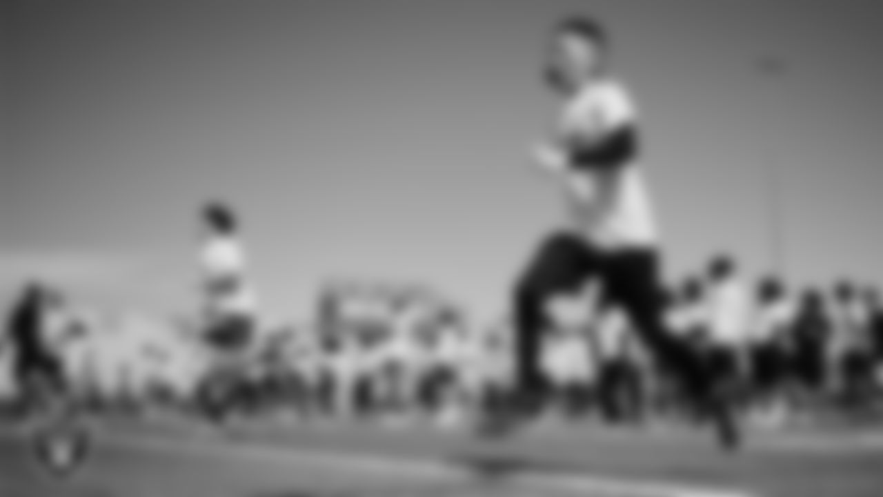 An athlete goes through a drill during a youth football combine at Durango High School.