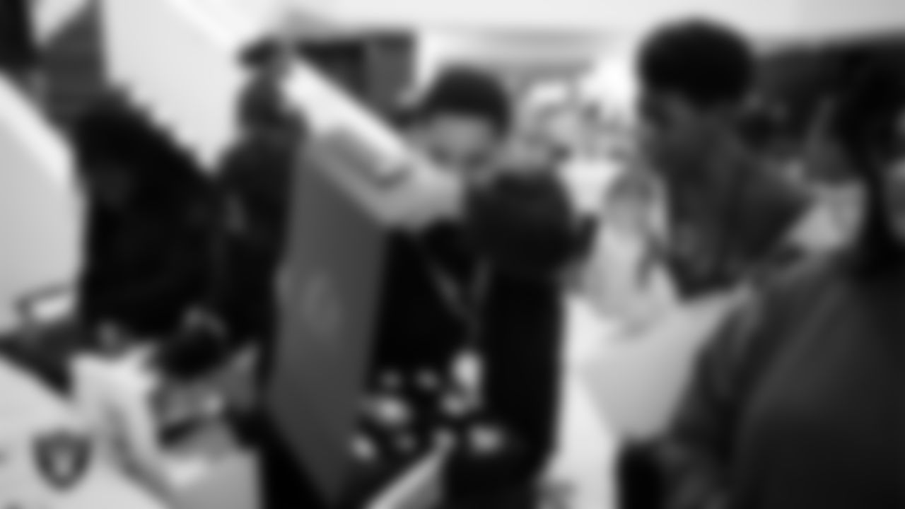 Canyon Springs High School students receive Las Vegas Raiders gear after the Employee Resource Group Mentorship Program at Las Vegas Raiders Headquarters.