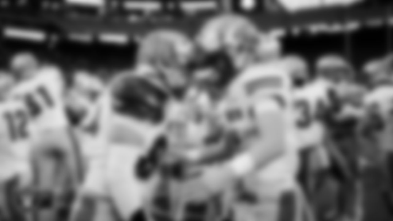 The McQueen High School football team celebrates after defeating Pinecrest Academy - Sloan Canyon in the NIAA 4A Division State Championship game at Allegiant Stadium.