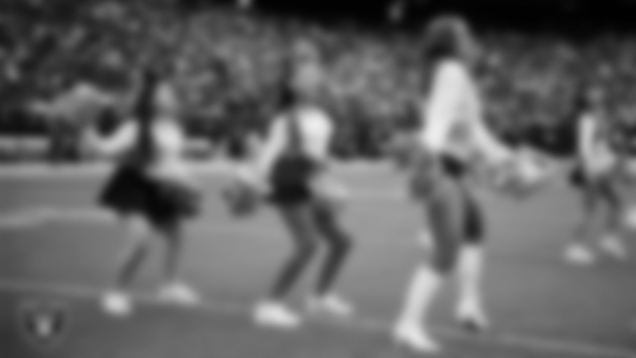 Raiderette Madisyn and Junior Raiderettes perform on the field before the preseason home game against the San Francisco 49ers at Allegiant Stadium.