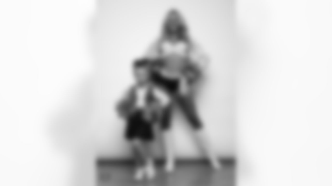 Raiderette Jessica poses for a photo with a Junior Raiderette during 2025 Media Day at The Studio.