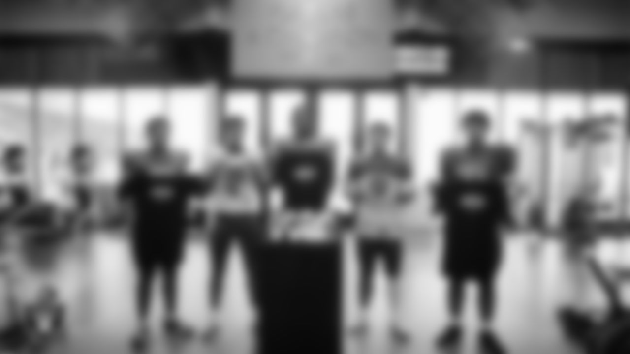 Members of the Bishop Gorman High School football team pose for a photo before practice at Bishop Gorman High School.