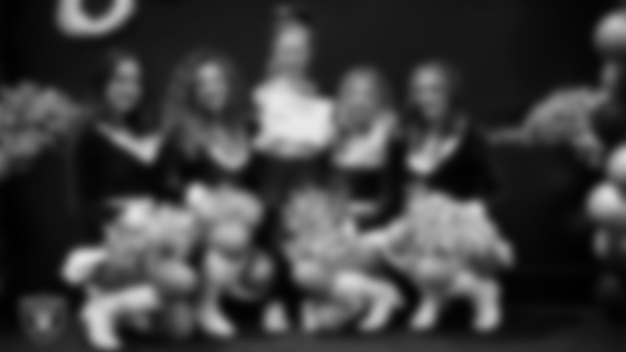 Raiderettes pose for a photo with a Junior Raiderette during the Junior Raiderettes Banquet at The Studio.