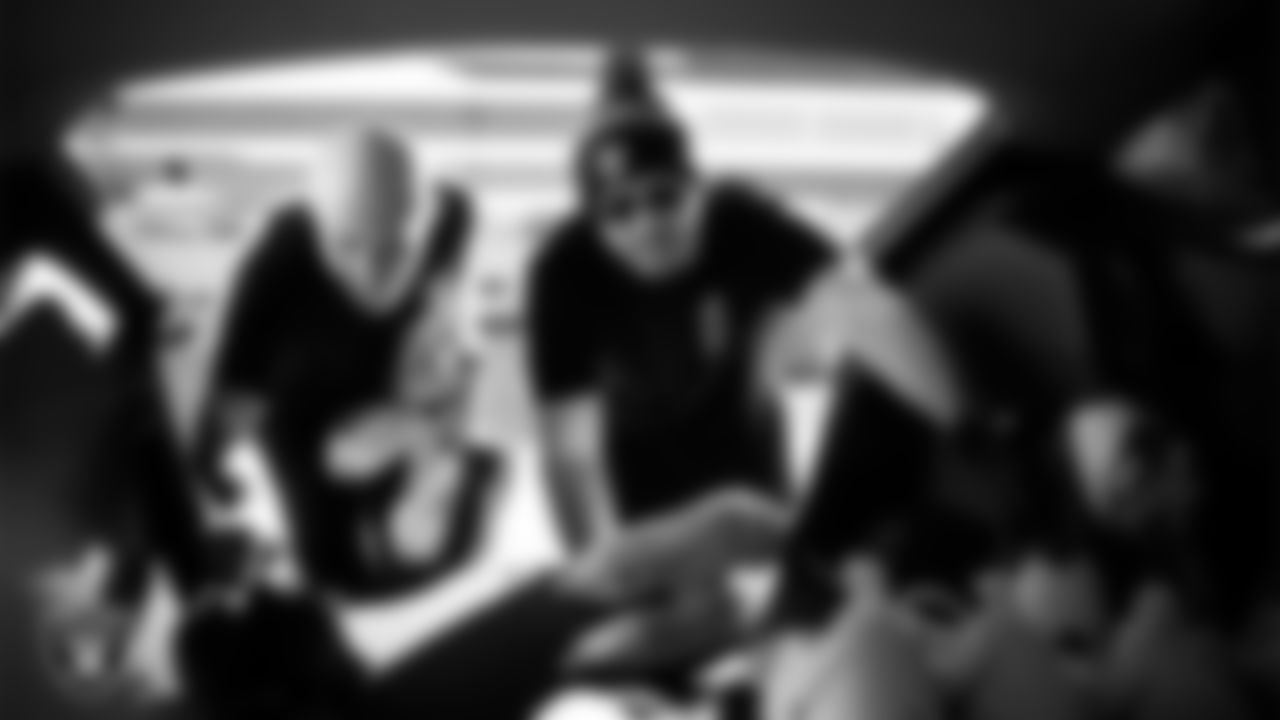 Las Vegas Raiders ambassadors load equipment into a vehicle during the Raiders' Equipment Blitz at Intermountain Health Performance Center.