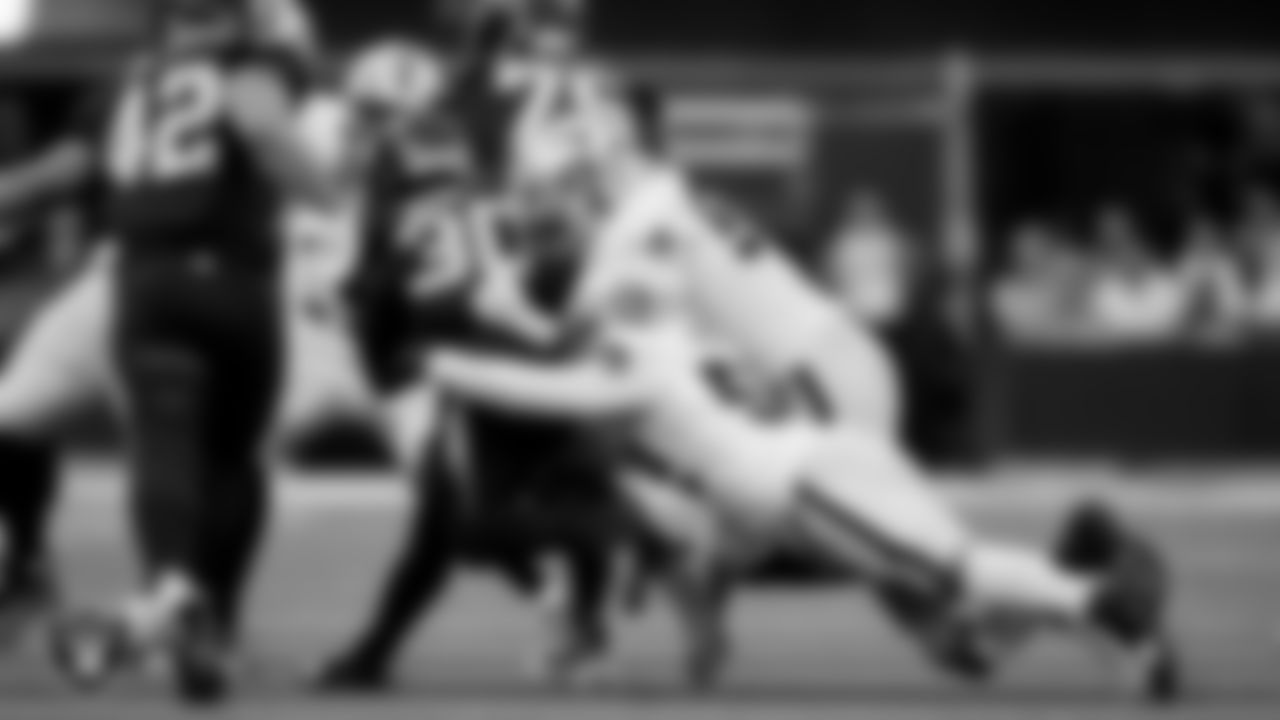 Las Vegas Raiders linebacker Elandon Roberts (52) and defensive tackle Jonah Laulu (96) during the regular season away game against the Los Angeles Chargers at SoFi Stadium.