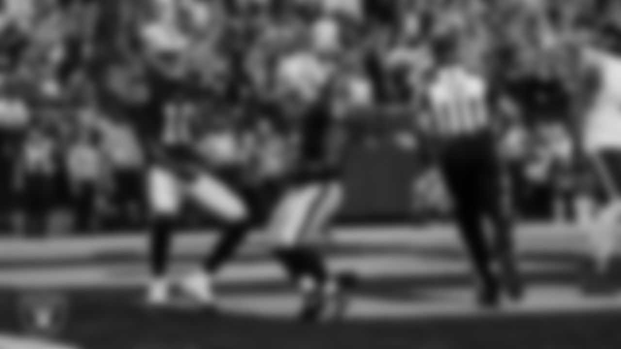 Las Vegas Raiders running back Ashton Jeanty (2) celebrates with wide receiver Dont'e Thornton Jr. (10) after making a 9-yard touchdown catch during the regular season home game against the Chicago Bears at Allegiant Stadium.