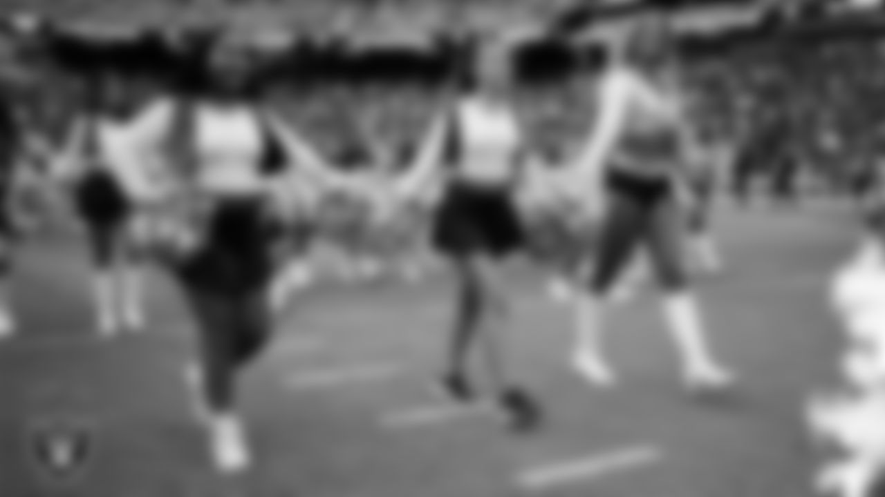Raiderette Cori and Junior Raiderettes exit the field after their performance before the preseason home game against the San Francisco 49ers at Allegiant Stadium.