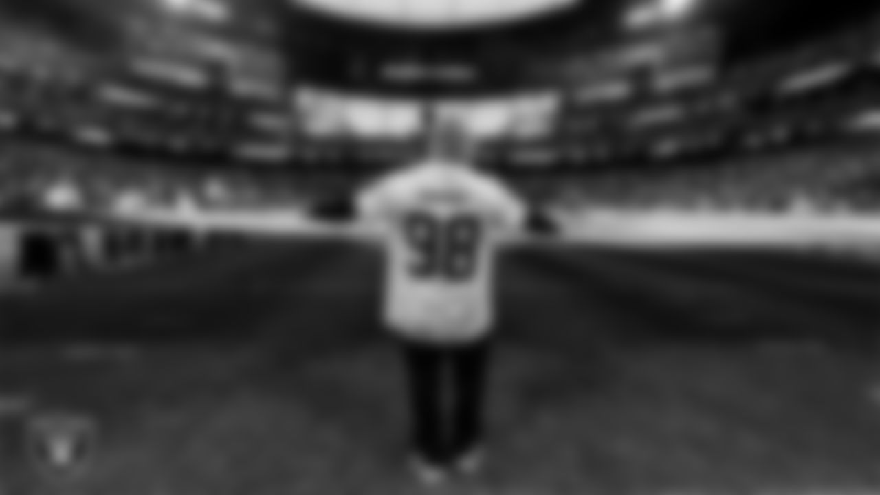 The American flag is displayed by Personal Seat License (PSL) holders on the field during the national anthem before the Las Vegas Raiders' regular season home game against the Cleveland Browns at Allegiant Stadium.