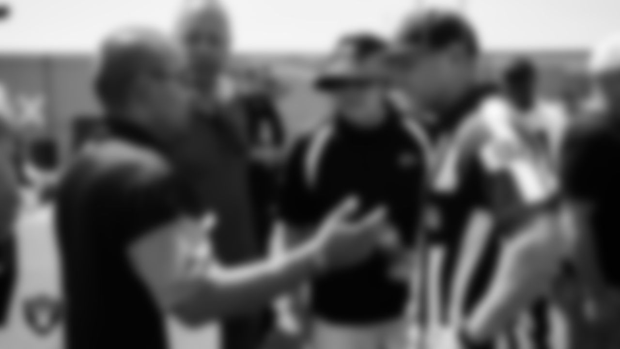Members of the Southern Nevada Officials Association meet with NFL official Shawn Hochuli and his crew after a 2025 Training Camp practice at Intermountain Health Performance Center.
