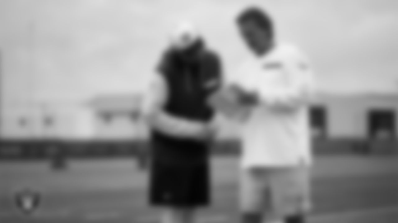 Las Vegas Raiders tight ends coach Luke Steckel and quarterbacks coach Greg Olson during practice at Intermountain Health Performance Center.