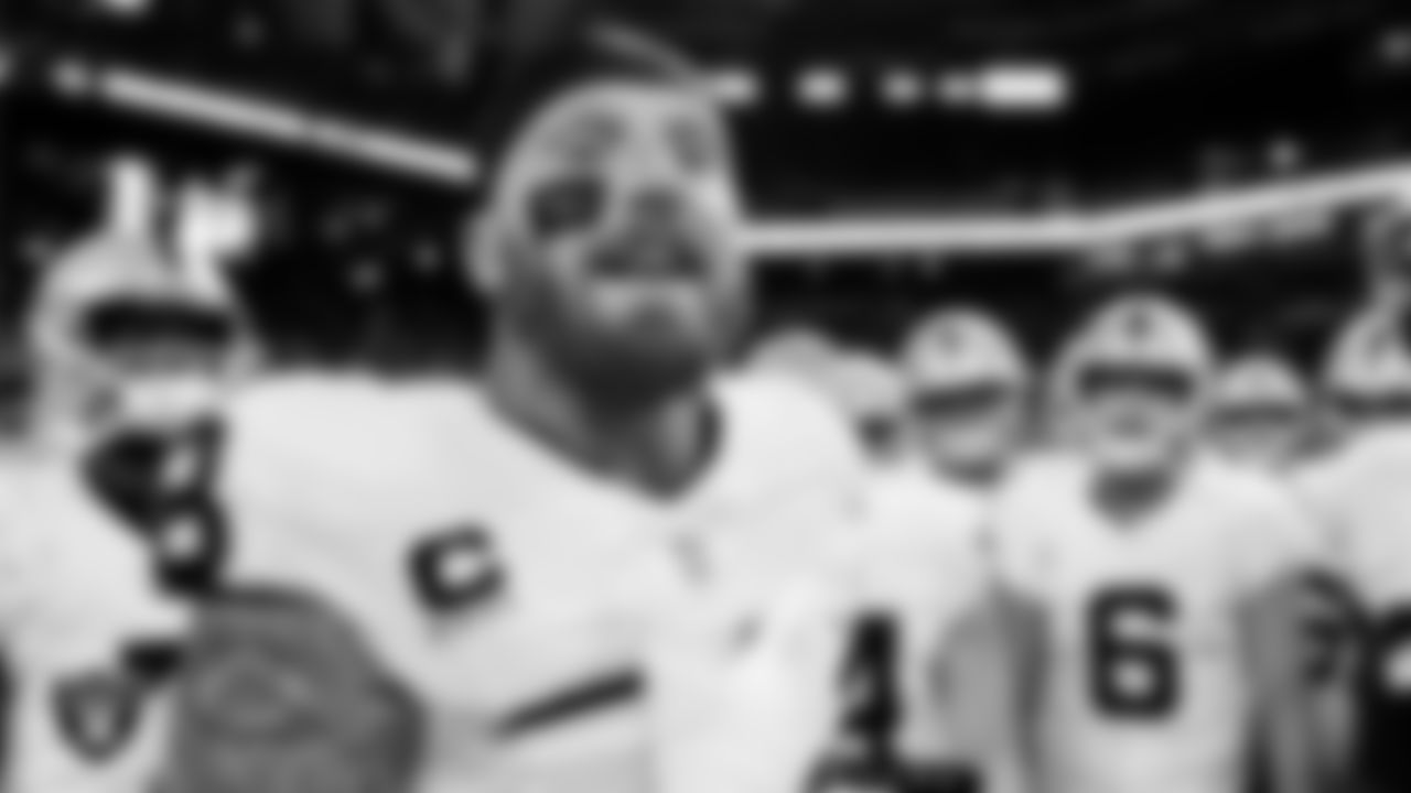 Las Vegas Raiders defensive end Maxx Crosby (98) in a huddle before the regular season away game against the Indianapolis Colts at Lucas Oil Stadium.