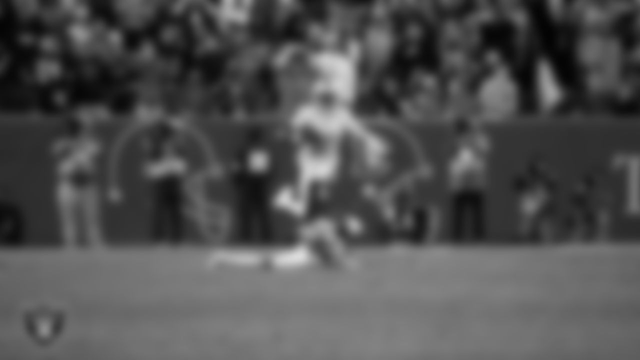 Las Vegas Raiders cornerback Kyu Blu Kelly (36) runs after intercepting a pass during the regular season away game against the Denver Broncos at Empower Field at Mile High.