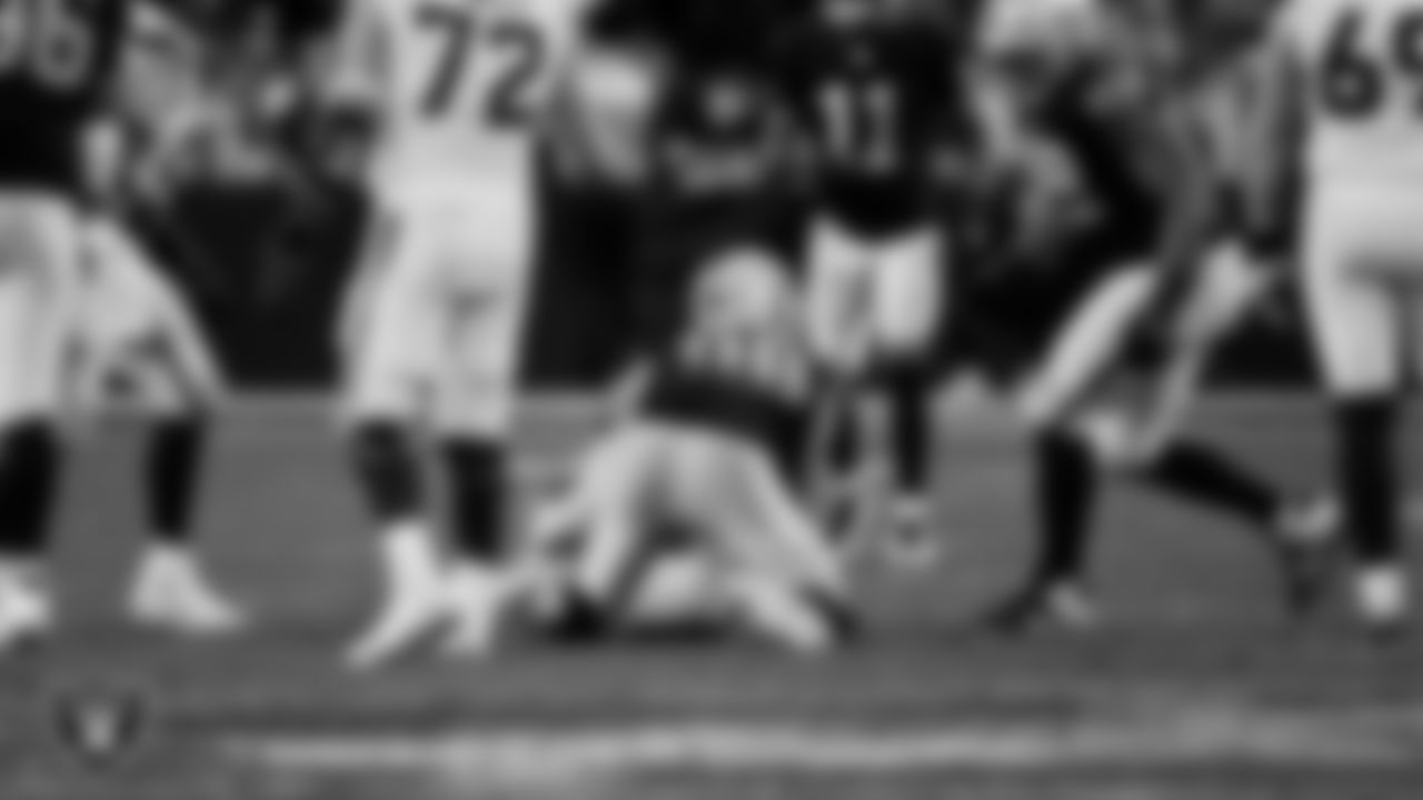 Las Vegas Raiders defensive end Maxx Crosby (98) sacks the quarterback during the regular season home game against the Denver Broncos at Allegiant Stadium.