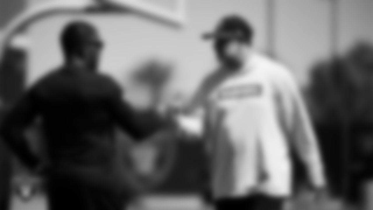 Las Vegas Raiders running backs coach Deland McCullough and linebackers coach John Glenn during practice at Intermountain Health Performance Center.