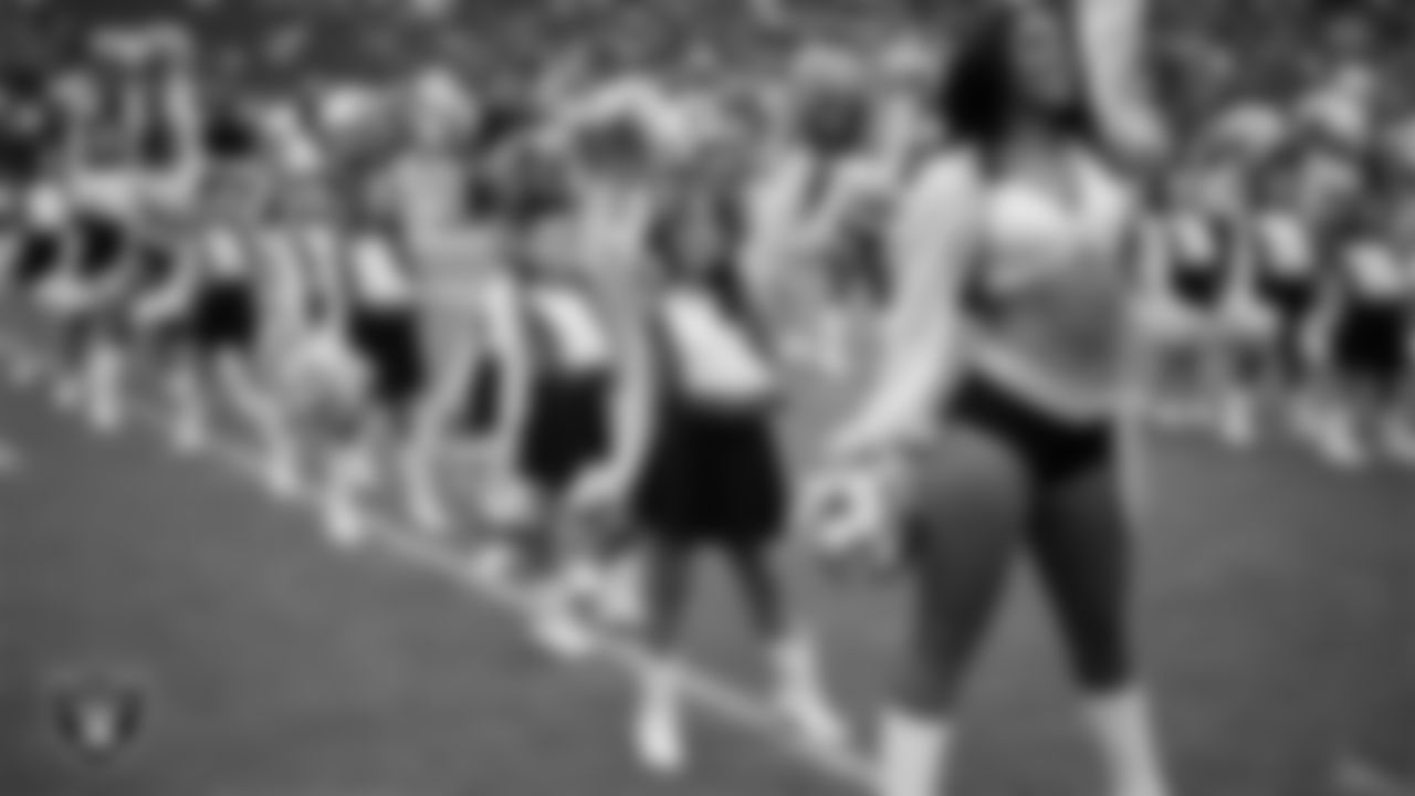 Raiderette Cierra and Junior Raiderettes perform on the field before the preseason home game against the San Francisco 49ers at Allegiant Stadium.