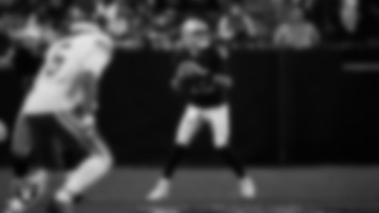 Las Vegas Raiders quarterback Aidan O'Connell (12) looks for a receiver during the regular season home game against the Kansas City Chiefs at Allegiant Stadium.