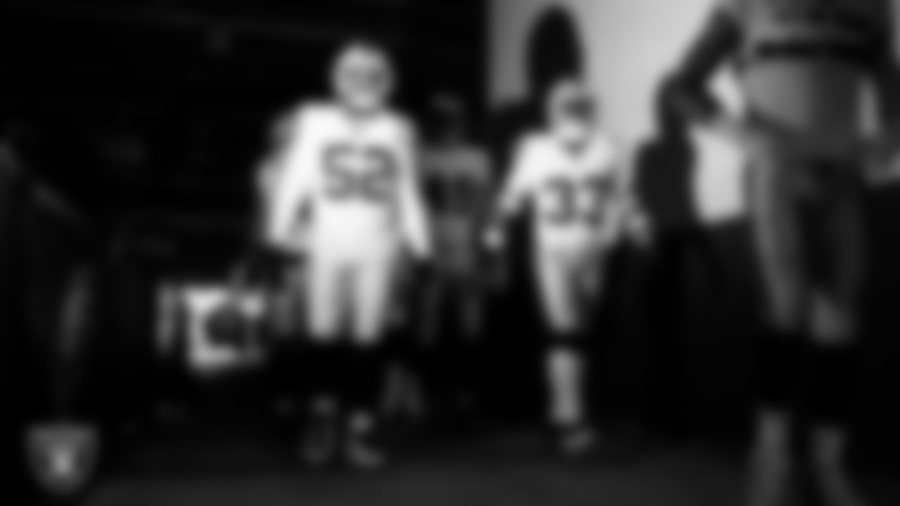 Las Vegas Raiders linebacker Elandon Roberts (52) and linebacker Jamal Adams (33) walk down the tunnel before the regular season away game against the Philadelphia Eagles at Lincoln Financial Field.