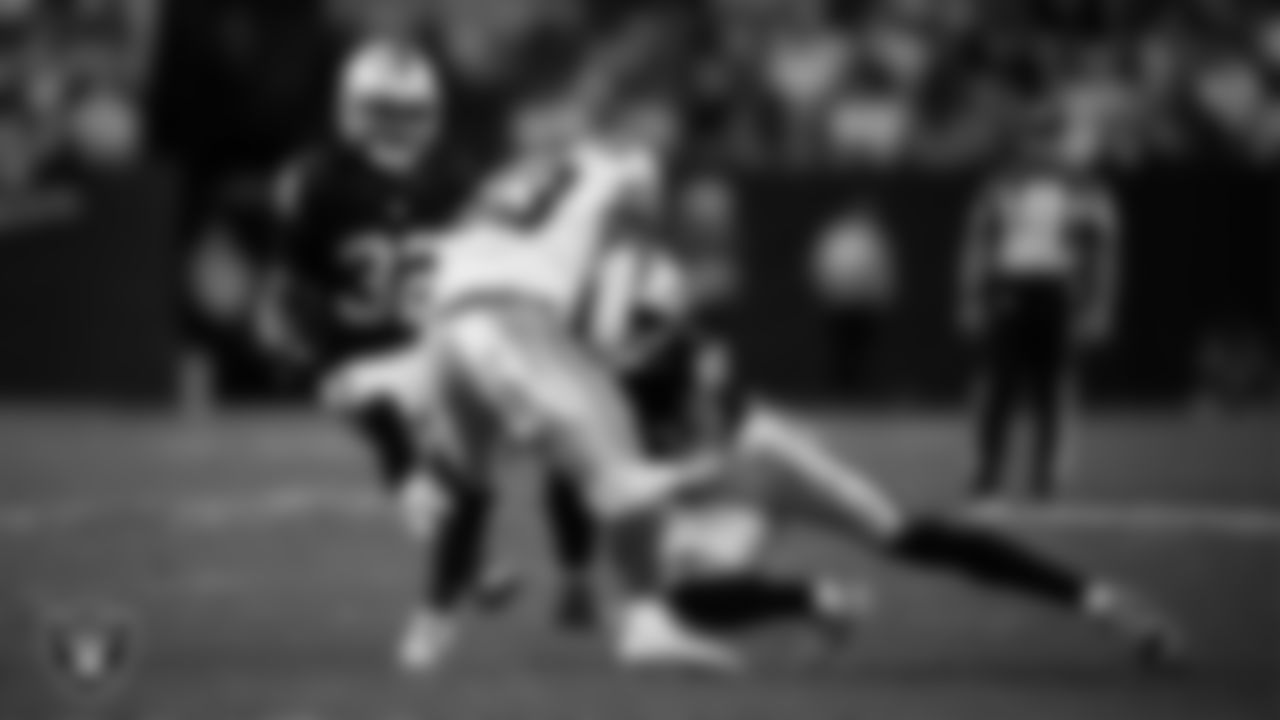 Las Vegas Raiders safety Isaiah Pola-Mao (20) makes a tackle during the regular season home game against the Dallas Cowboys at Allegiant Stadium.