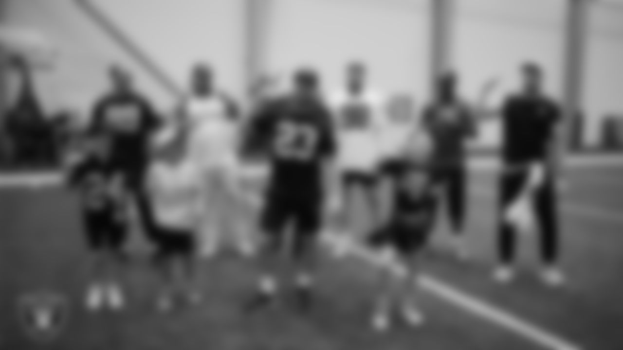 The Las Vegas Raiders dance with Intermountain Children's Health patients Colston and Jade at Intermountain Health Performance Center.