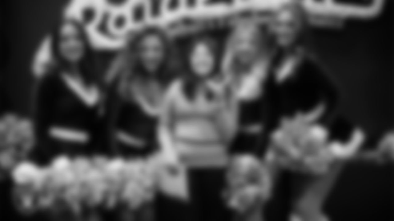 Raiderettes pose for a photo with a Junior Raiderette during the Junior Raiderettes Banquet at The Studio.