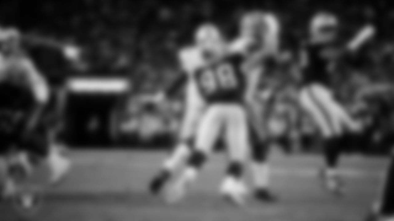 Las Vegas Raiders defensive end Maxx Crosby (98) forces a fumble during the regular season home game against the Dallas Cowboys at Allegiant Stadium.
