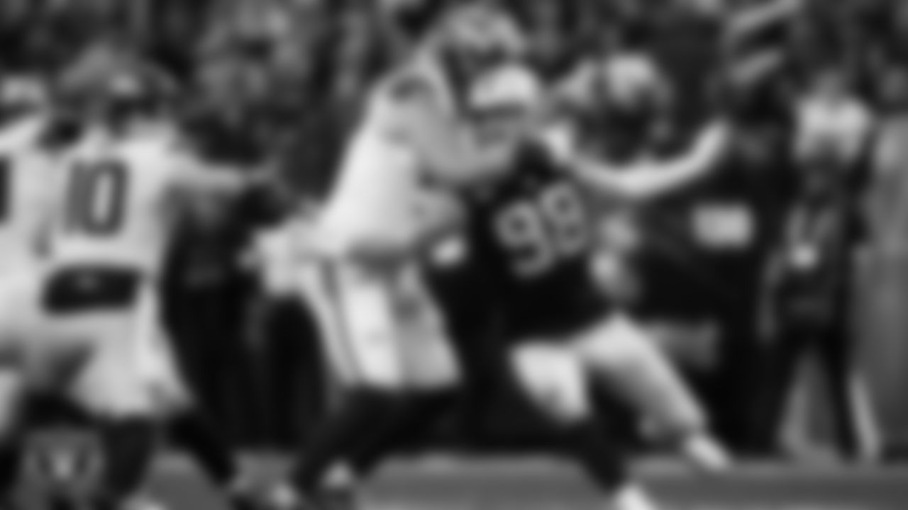 Las Vegas Raiders defensive end Maxx Crosby (98) pressures the quarterback during the regular season home game against the Denver Broncos at Allegiant Stadium.