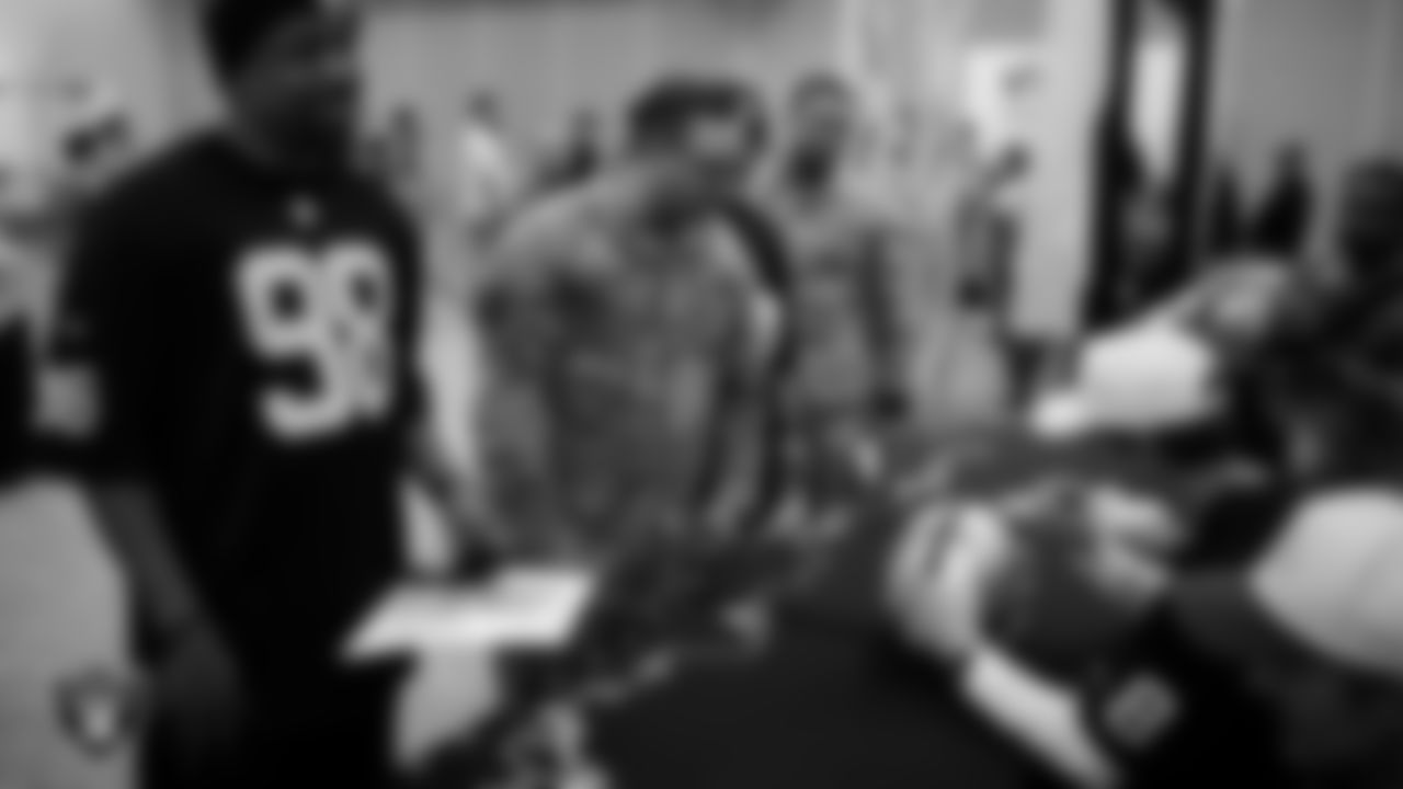 Las Vegas Raiders kicker Daniel Carlson (8) signs autographs for service members at Nellis Air Force Base.