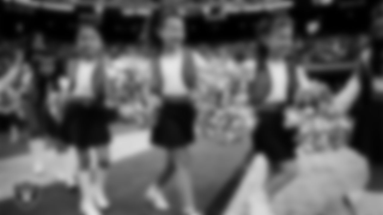 Junior Raiderettes enter the field for their performance on the field before the preseason home game against the San Francisco 49ers at Allegiant Stadium.