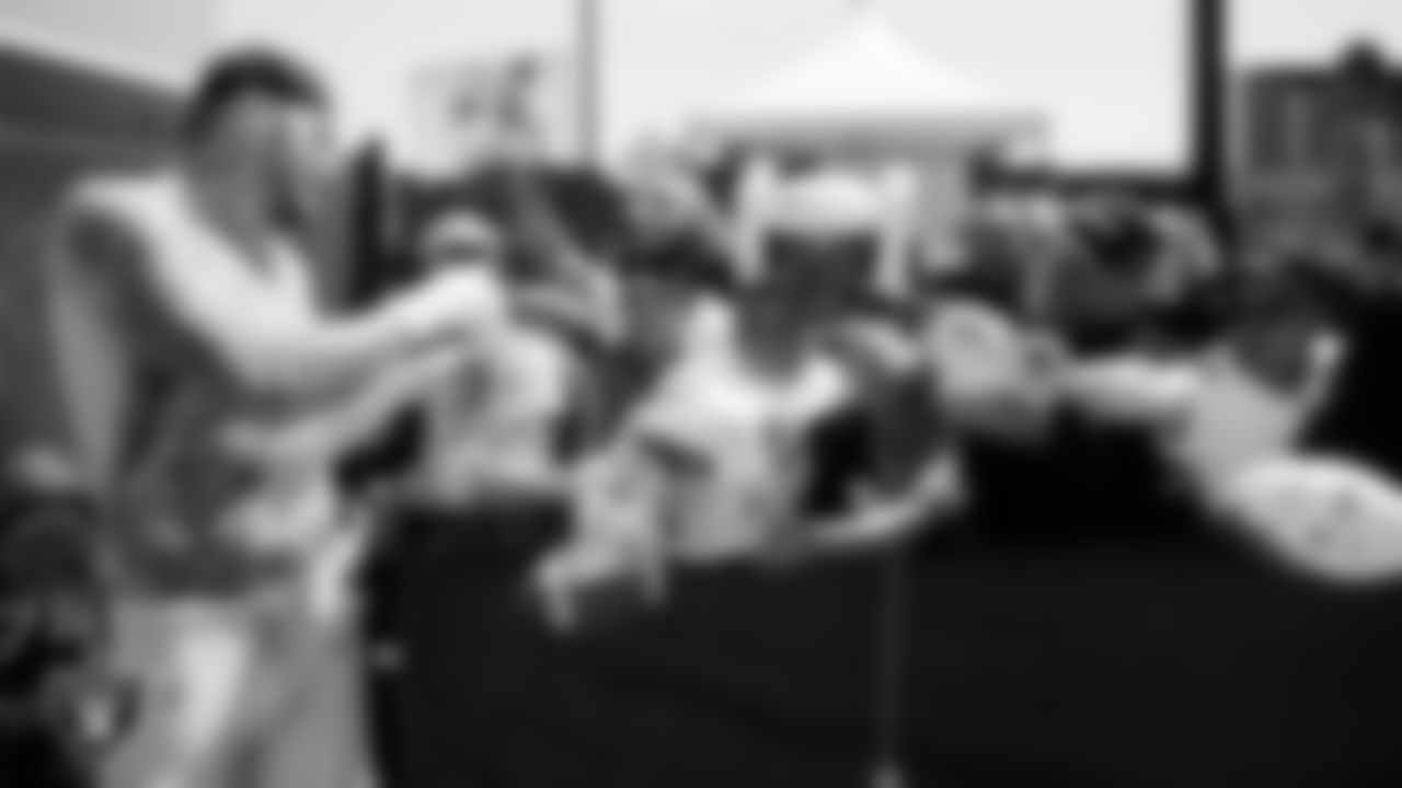 Las Vegas Raiders defensive end Maxx Crosby (98) signs autographs after a 2025 Training Camp practice at Intermountain Health Performance Center.