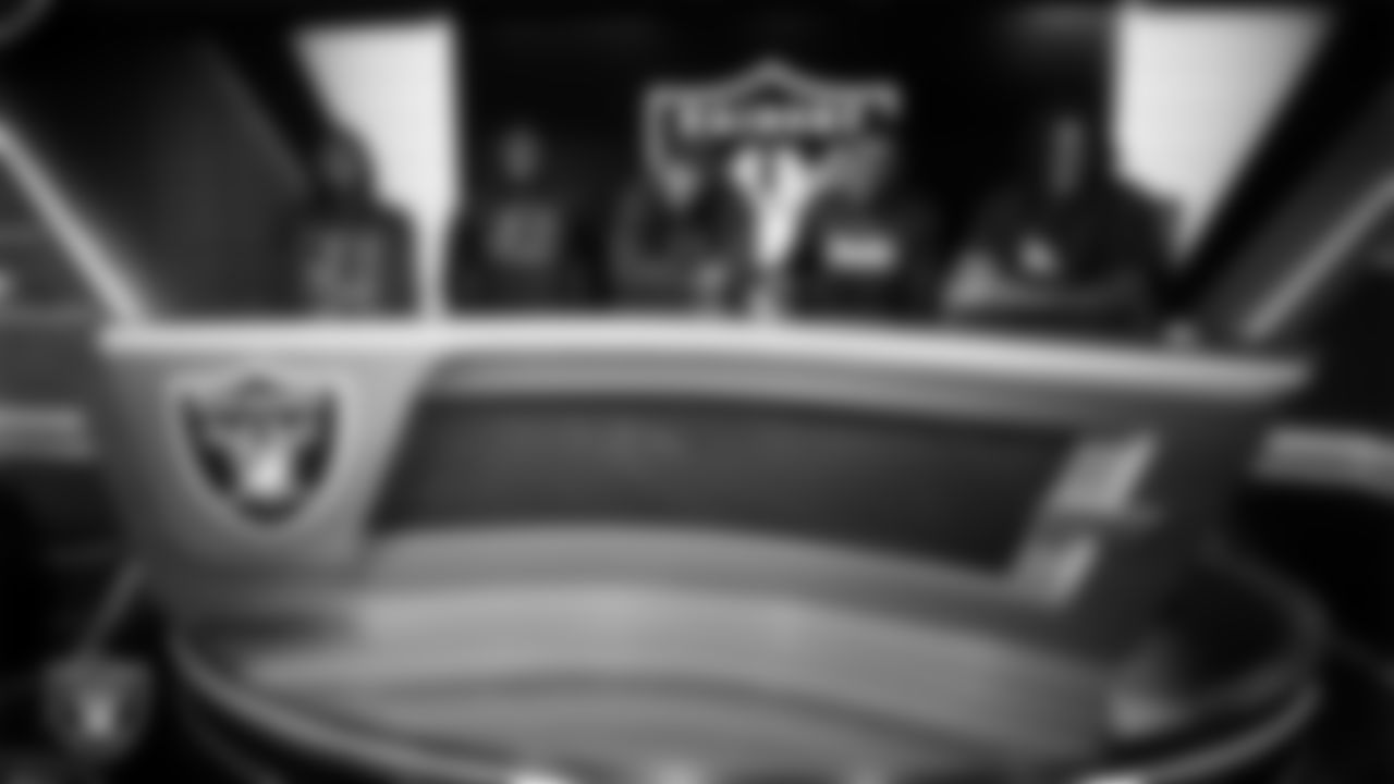 Members of the Jackson State University football team pose for a photo in the Cox Studio at Intermountain Health Performance Center.