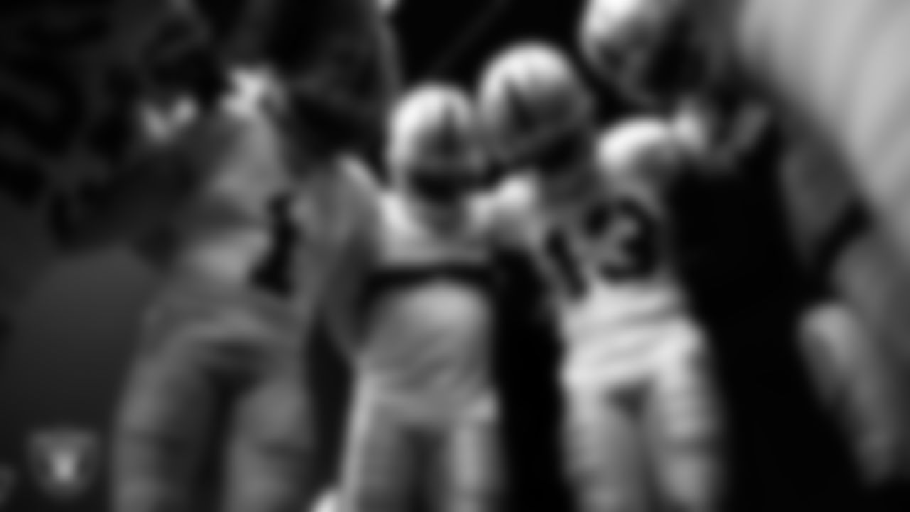 The Las Vegas Raiders returners huddle in the tunnel before the preseason away game against the Seattle Seahawks at Lumen Field.