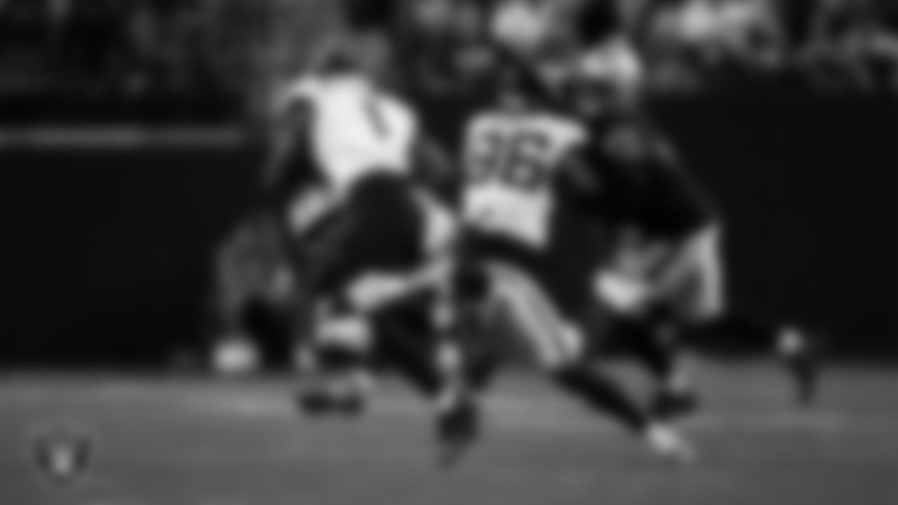 Las Vegas Raiders safety Isaiah Pola-Mao (20) makes a tackle during the regular season home game against the Jacksonville Jaguars at Allegiant Stadium.