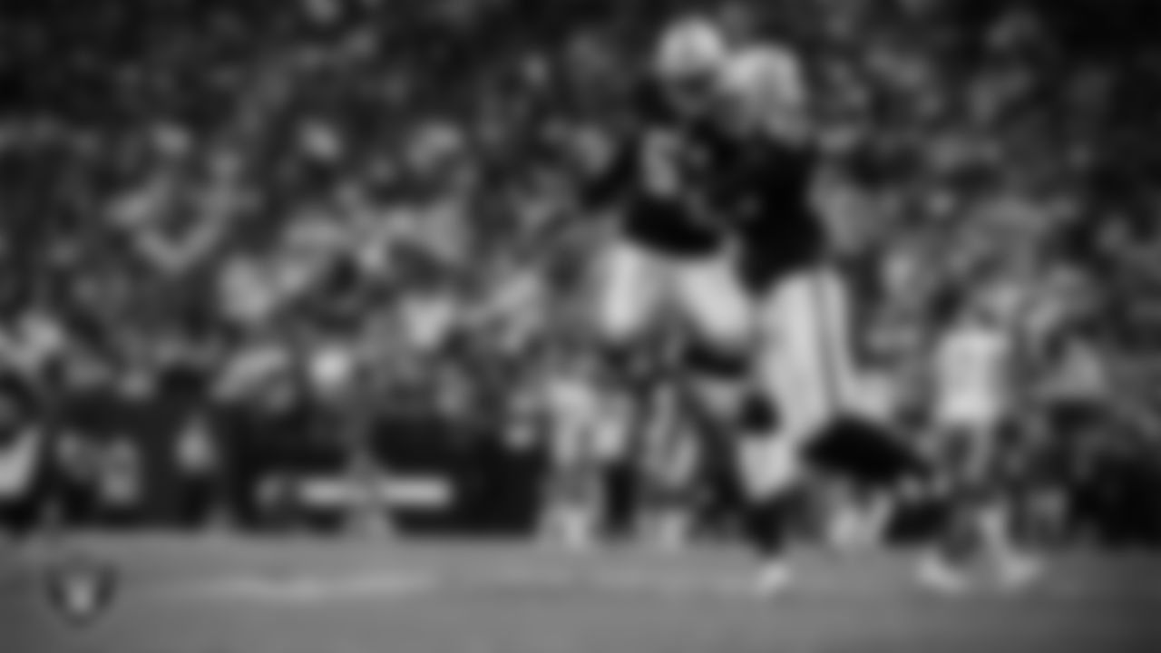 Las Vegas Raiders defensive end Charles Snowden (49) celebrates with defensive end Malcolm Koonce (51) after sacking the quarterback during the regular season home game against the Kansas City Chiefs at Allegiant Stadium.