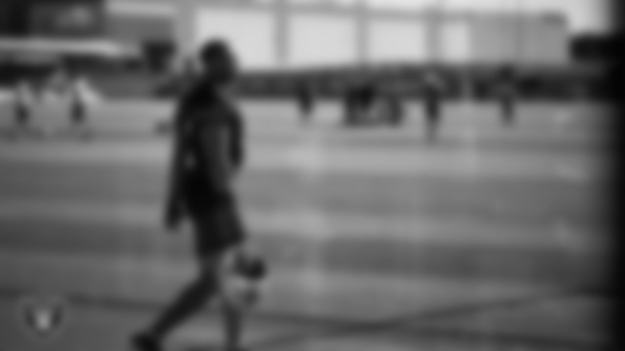 Las Vegas Raiders defensive end Tyree Wilson (9) walks out to the field for practice at Intermountain Health Performance Center.